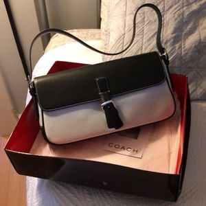 Black and light blue Coach shoulder bag.